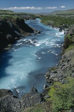 ICELAND, Borgarfjordur, Hvita River. Water comes from beneath Hallmundarhraun lava field.