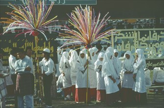 BRUNEI, Bandar Seri Begawan, Women in procession as part of the celebrations for Mohamed’s birthday