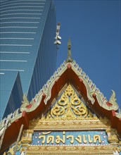 THAILAND , Bangkok, The peak of the roof of the Wat Muang Khae Temple with the Communications