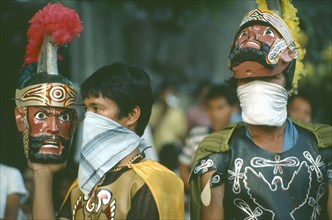 PHILIPPINES, People, "Two men in costume, one wearing and one carrying mask during the Ati-Atihan