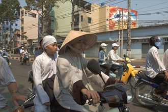VIETNAM, South, Ho Chi Minh City, Buddhist monks riding a motorbike