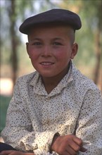 CHINA, Xinjiang Province, Kashgar, Portrait of young Tajik boy