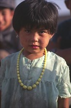 CHINA, Xinjiang Province, Kashgar, Portrait of young Tajik girl
