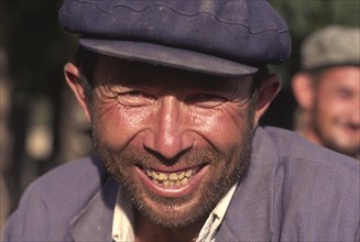 CHINA, Xinjiang Province, Kashgar,  Head and shoulders portrait of Tajik man