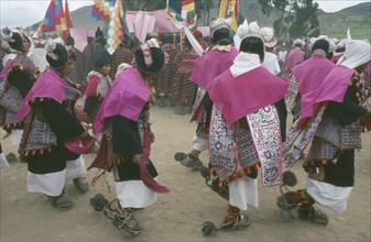BOLIVIA, Sucre, Tarabuco, Male dancers in costume during Phujllay celebrations.