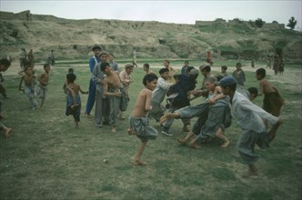 PAKISTAN, Children, Play, Hunza children playing tag.