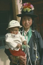 CHINA, Qinghai Province, Huzhu District, Tu minority Yellow Hat Buddhist mother and daughter.
