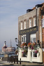 ENGLAND, Hampshire, Portsmouth, The Spice Island Inn at Old Portsmouth with HMS Warrioir and the