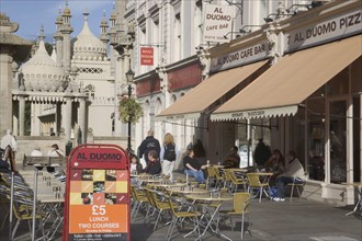 ENGLAND, East Sussex, Brighton, The Al Duomo Italian restaurant exterior with people sat on outside