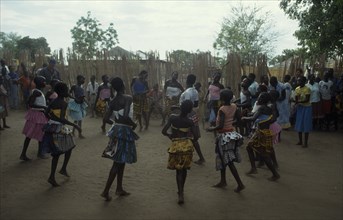 UGANDA, Gulu, Circle of dancing girls.