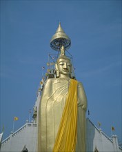 THAILAND, Bangkok, Banglamphu, "Wat Indrawiharn. Standing Buddha wearing orange sash, containing