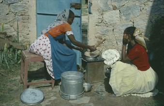 ERITREA, Afabet, Women cooking over charcoal.
