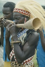 RWANDA, Festivals, Tutsi musicians playing horns.