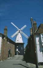 ENGLAND, Kent, Cranbrook, Road leading to Windmill with houses either side.