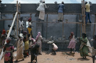 SOMALIA, Construction, Settled nomads building houses.