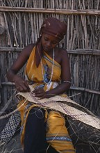SOMALIA, General, Woman making woven mat.