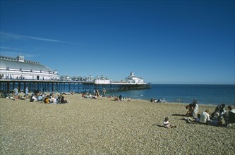 ENGLAND, East Sussex, Eastbourne, View from occupied shingle beach towards Pier