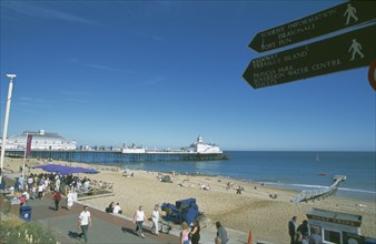 ENGLAND, East Sussex, Eastbourne, View across busy seafront towards shingle beach and pier with
