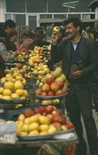 RUSSIA, Dagestan, Derbent, Fruit sellers at market.