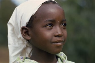 KENYA, Tribal People, "Head and shoulders portrait of young Kikuyu girl wearing headscarf, three