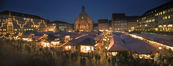 GERMANY, Bavaria, Nuremberg, Panoramic view of the Christmas Market in Hauptmarkt with The