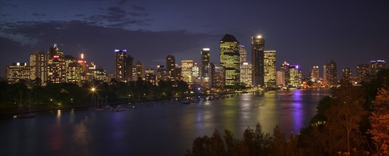 AUSTRALIA, Queensland, Brisbane, Panoramic view of the city across the Brisbane River as dusk falls