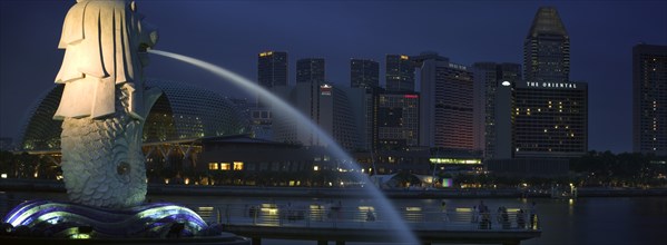 SINGAPORE, Merlion Statue, Night time view of the Esplanade - Theatres on the Bay complex from