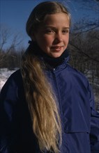 CHILDREN, Portraits, "Portrait of young girl with long blonde hair outdoors, dressed for cold