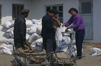 NORTH KOREA, N. Pyongan Province, Uiju County, WFP rice distribution to farmers affected by