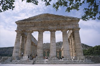 ITALY, Sicily, Segesta, Doric Temple. Ruins of the ancient city. Colonnaded structure framed by
