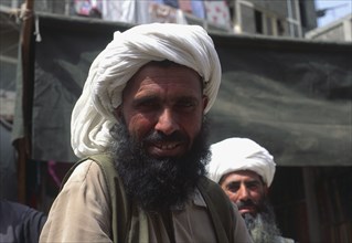 PAKISTAN, La Hore, Afghan Tradesman with beard and white head-dress.
