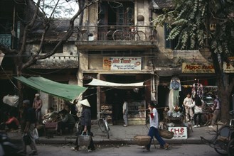 VIETNAM, North, Hanoi, "City Old Quarter street scene with roadside vendors, pedestrians and