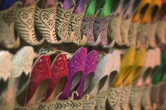UAE, Dubai, Side view of colourful traditional Arab footware for sale in Old Souk.