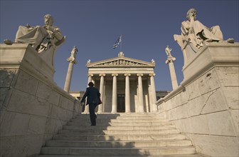 GREECE, Central, Athens, A lady walking up the steps leading to the Numismatic Museum.