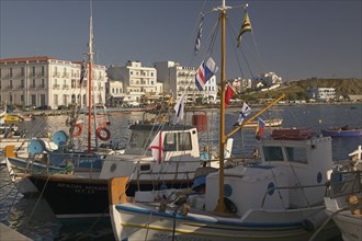 SPAIN, Cyclades Islands, Tinos, Fishing boats docked in the town’s port.