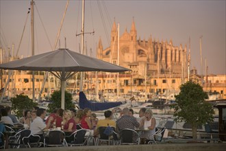 SPAIN, Balearic Islands, Mallorca, "Palma de Mallorca, Cafe next to the port with the Cathedral