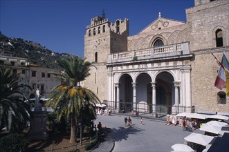 ITALY, Sicily, Palermo, Monreale. II Duomo Norman Cathedral exterior with people walking on road