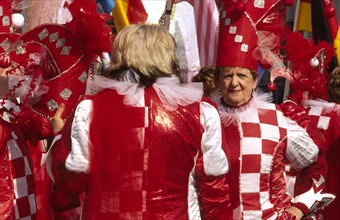CROATIA, Kvarner, Rijeka, "Mask carnival women in jesters' costumes. The streets of Rijeka are a