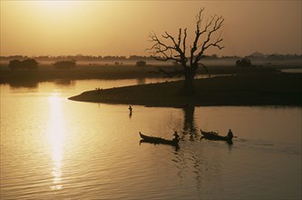 MYANMAR, Taungthaman Lake, View from U Bein Bridge at Amarapura near Mandalay with canoes
