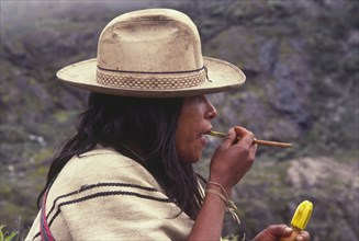 COLOMBIA, Santa Marta, Sierra Nevada , "Ica indian taking coca, gourd in left hand has calcium