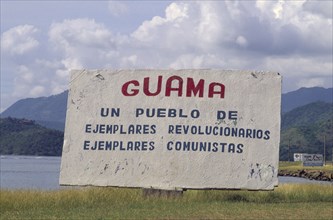 CUBA, Guama, "Sign welcoming people to the town, including revolutionary writings."
