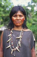 PERU, Nuevo Mundo, Camisea, Machiguenga Indian woman wearing beaded necklaces.