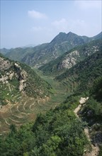 CHINA, Hebei, Beijing, Valley with agricultural terracing.