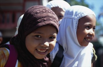 20069822 INDONESIA  Aceh Province Group of young Moslem girls with headscarves and smiling.