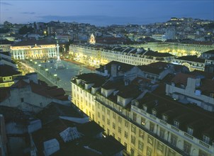 PORTUGAL, Lisbon, Baixa.  Praca dom Pedro IV at night with illuminated buildings and light trails