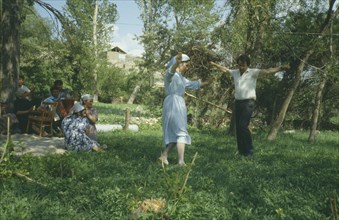 RUSSIA, Dagestan, Rahata Village, Chechen man and Avar girl dancing.