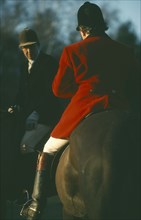 SPORT, Equestrian, Foxhunting, Riders on horseback with male rider wearing traditional red coat