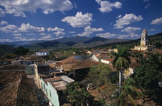 CUBA, Trinidad, View across red tiled city rooftops towards Iglesia San Franciso de Paula bell