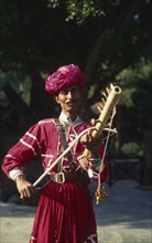 INDIA, Rajastan, Musician with Tambora instrument.