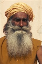 INDIA, Rajasthan, Jaisalmer, "Indian guru, with long beard and yellow head-dress."